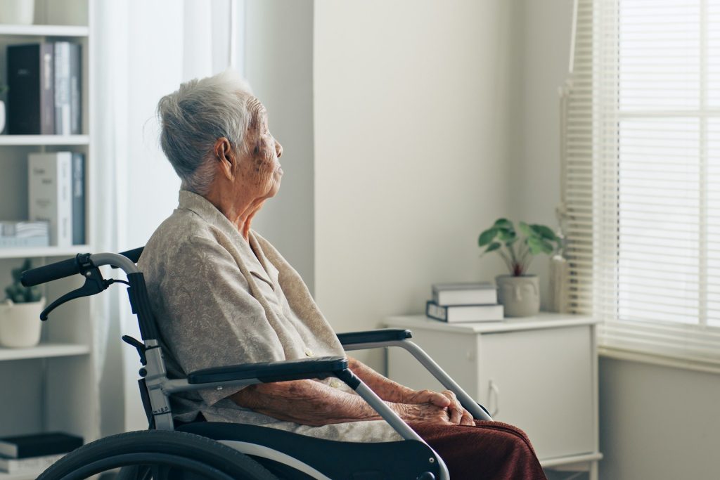 Old woman sitting on a chair