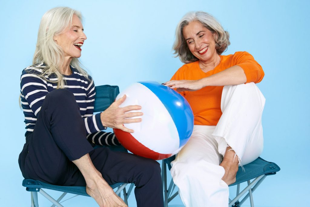 Two women sitting on chair