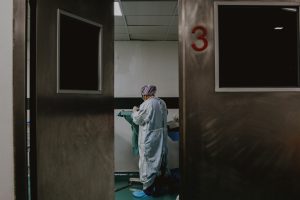 Man in white and blue robe