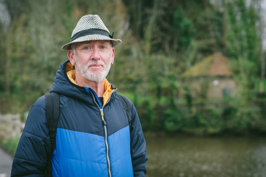 A man in blue jacket