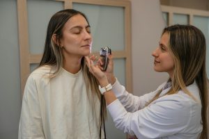 A woman holding another persons face