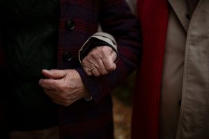 A close-up of senior couple hands