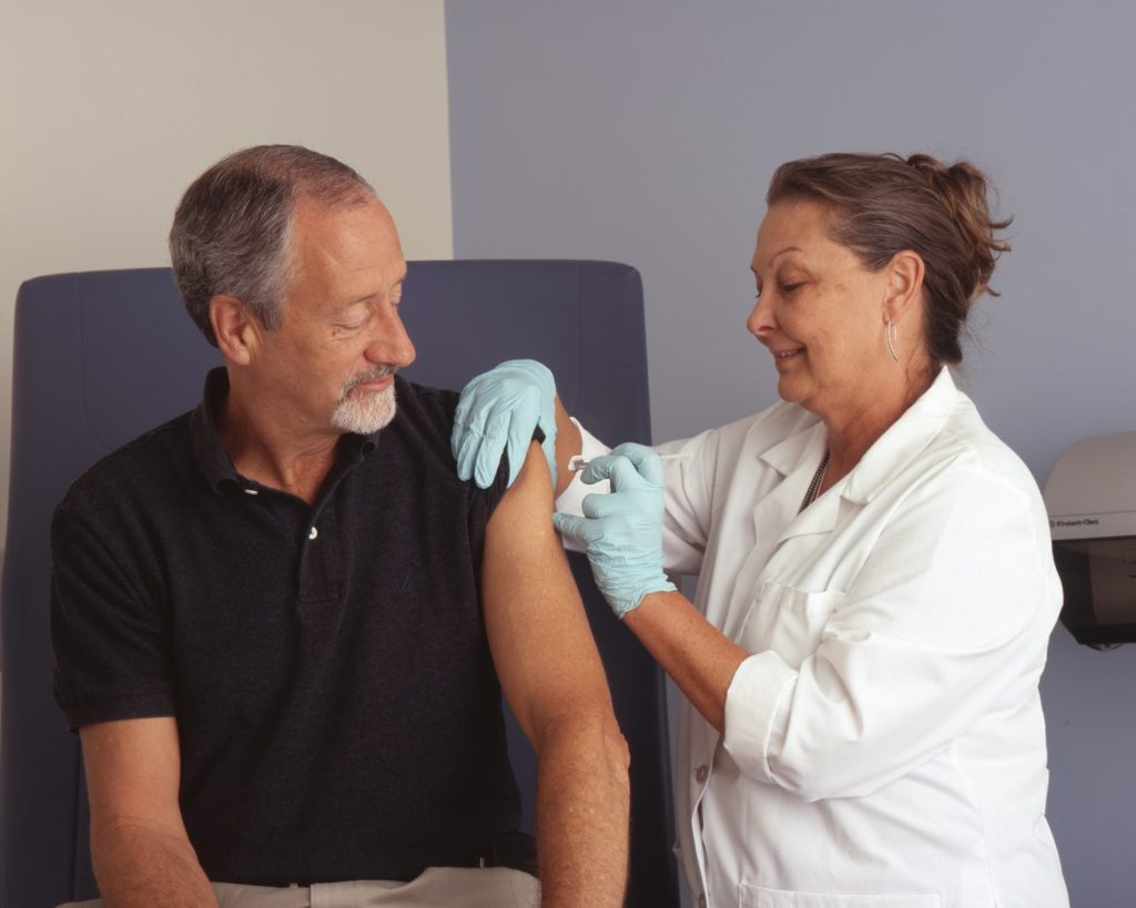 Two person vaccinating