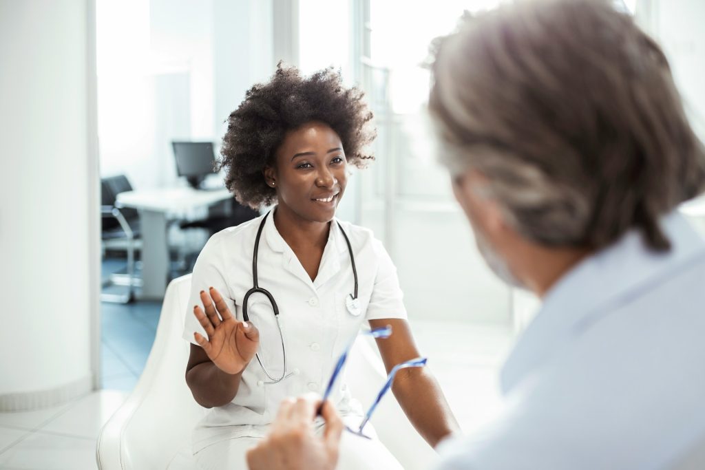 A female doctor talking to another person