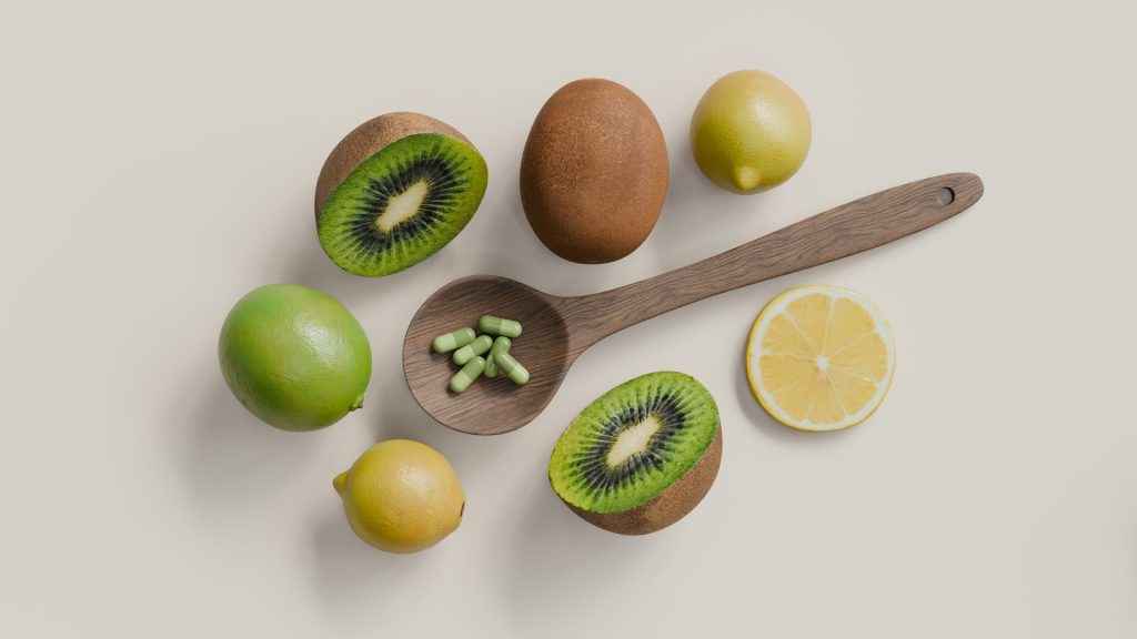 A sliced fruit and a wooden spatula